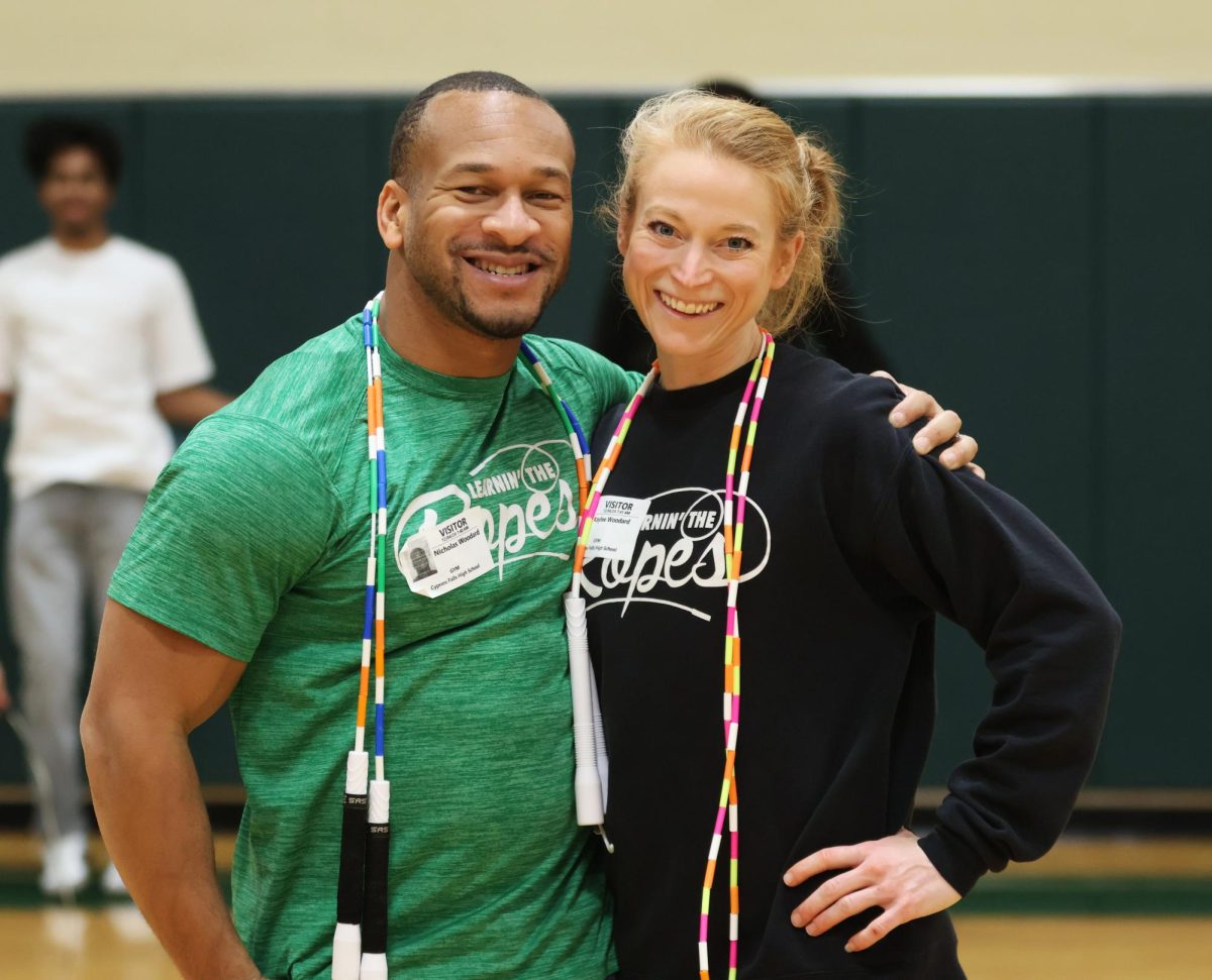 Nick Woodard and Kaylee Woodard stand in the Cypress Falls gym.